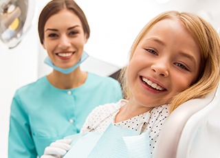 Young girl smiling in dental chair