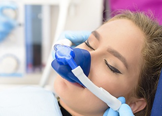 Teen girl wearing nitrous oxide nose mask